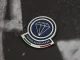 How are custom badges made and what materials are used?
